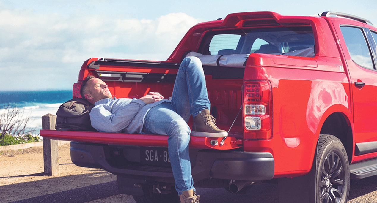 A Man Lying in a Truck Bed